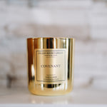 Gold candle with 'Cullen House Candles' label on a marble surface