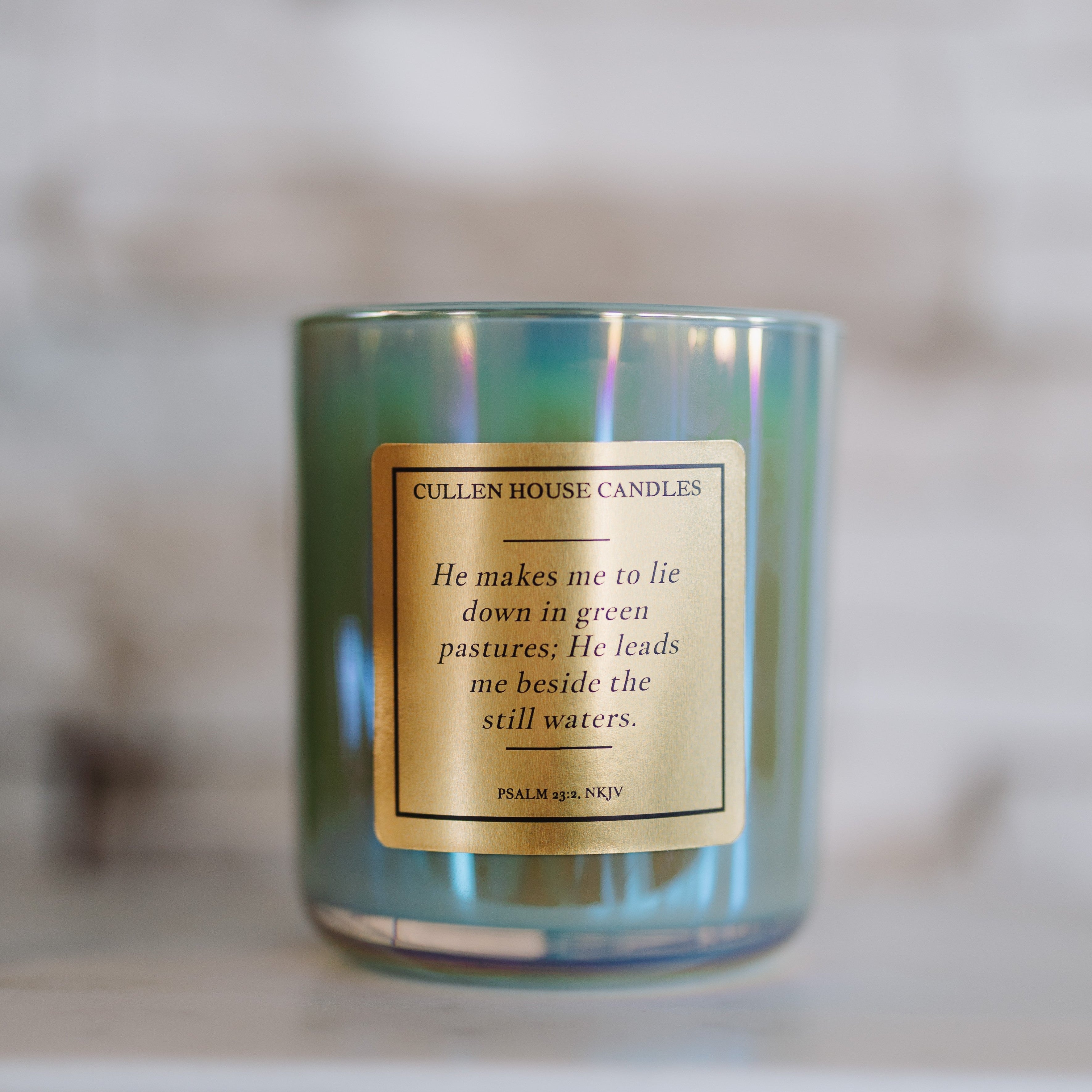 Candle with a label on a blurred background