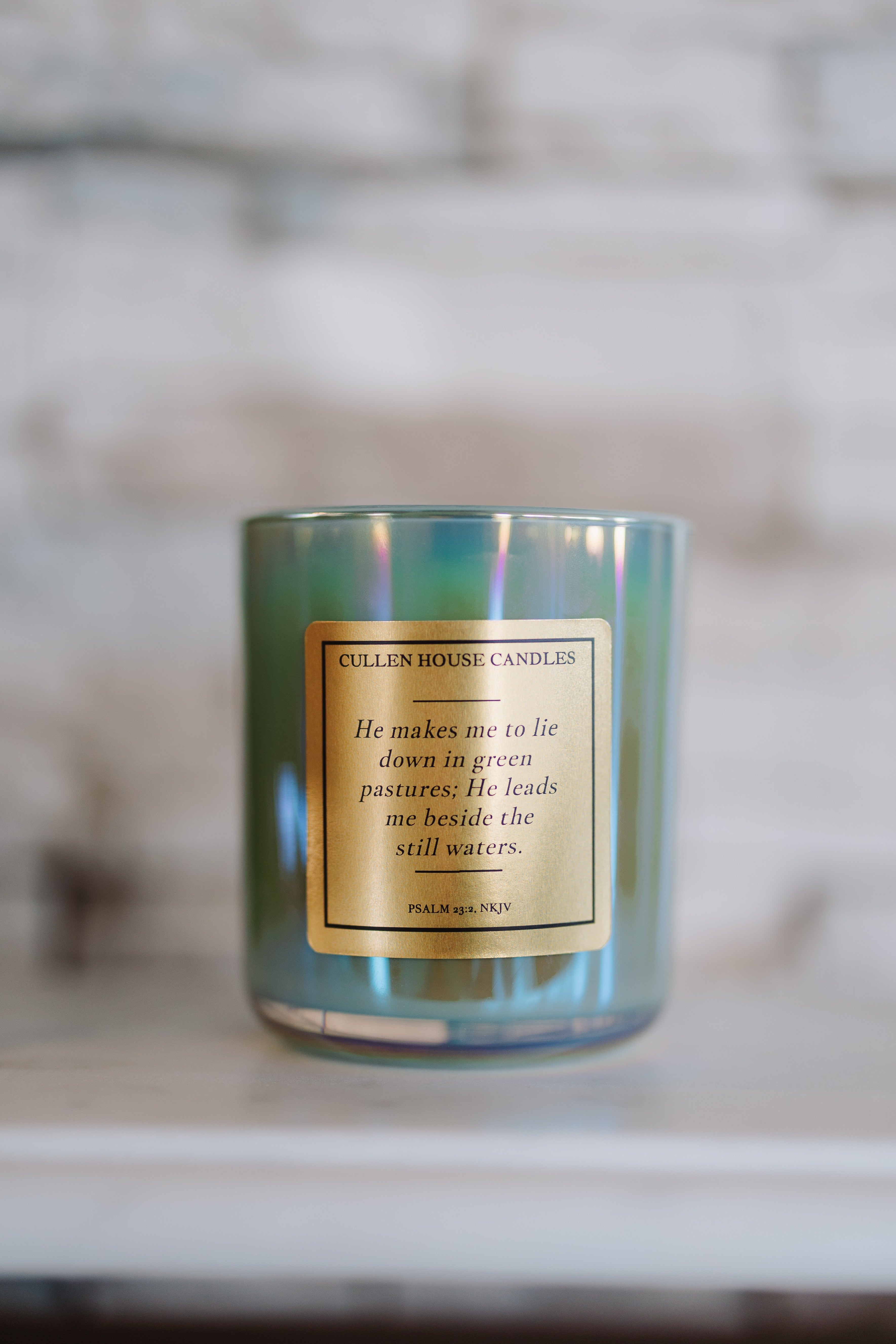 Candle with a label on a blurred background