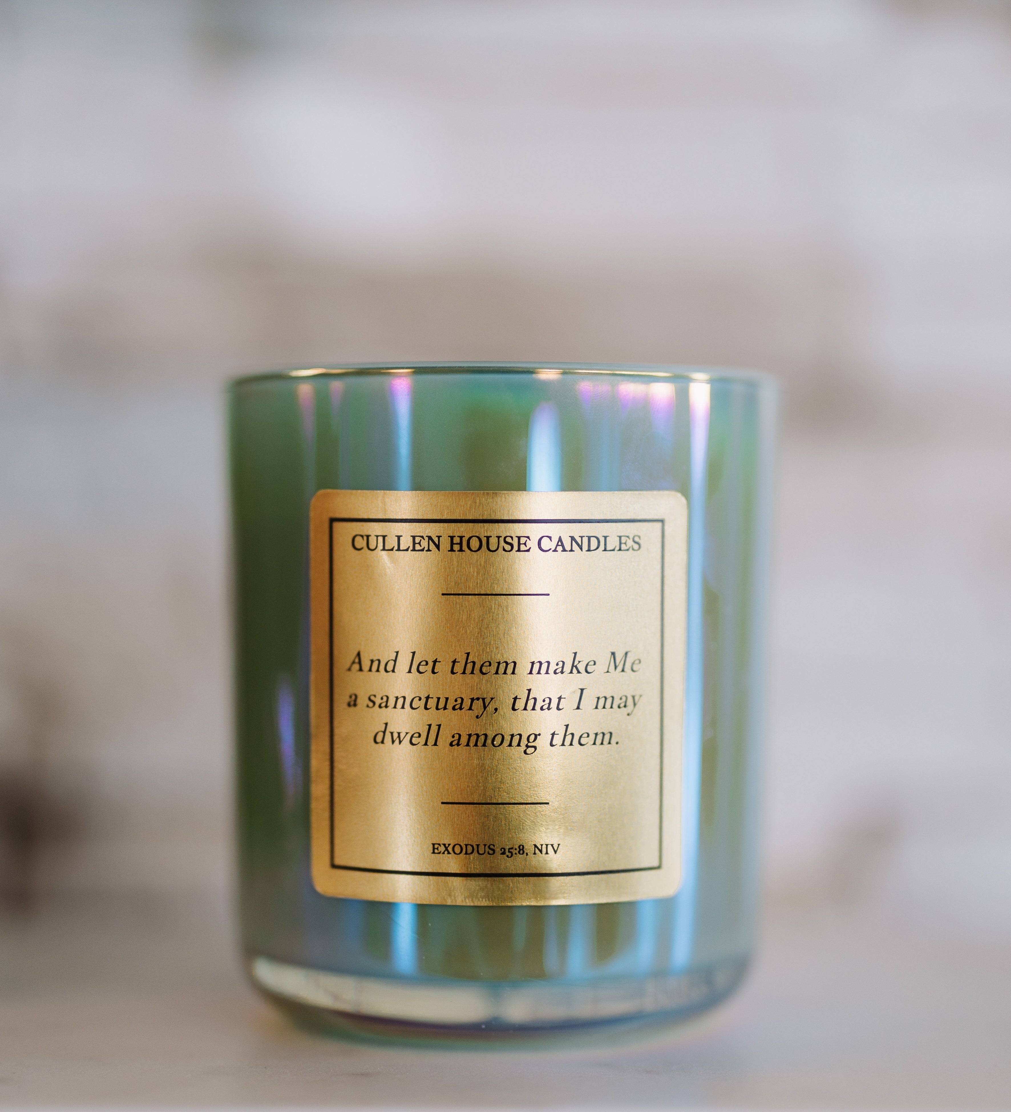 Candle with a label on a blurred background