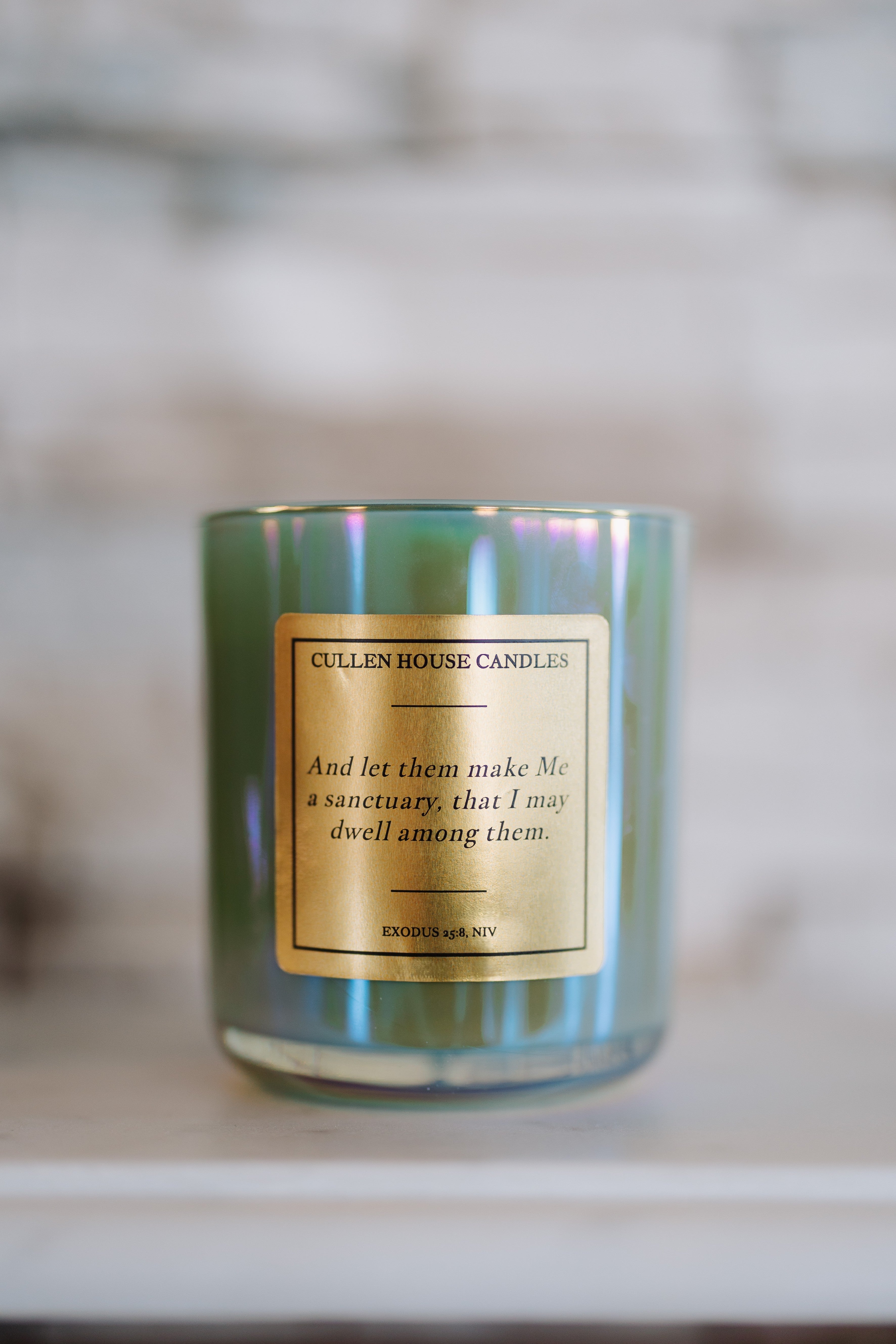 Candle with a label on a blurred background