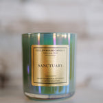 Candle with a gold label on a blurred background