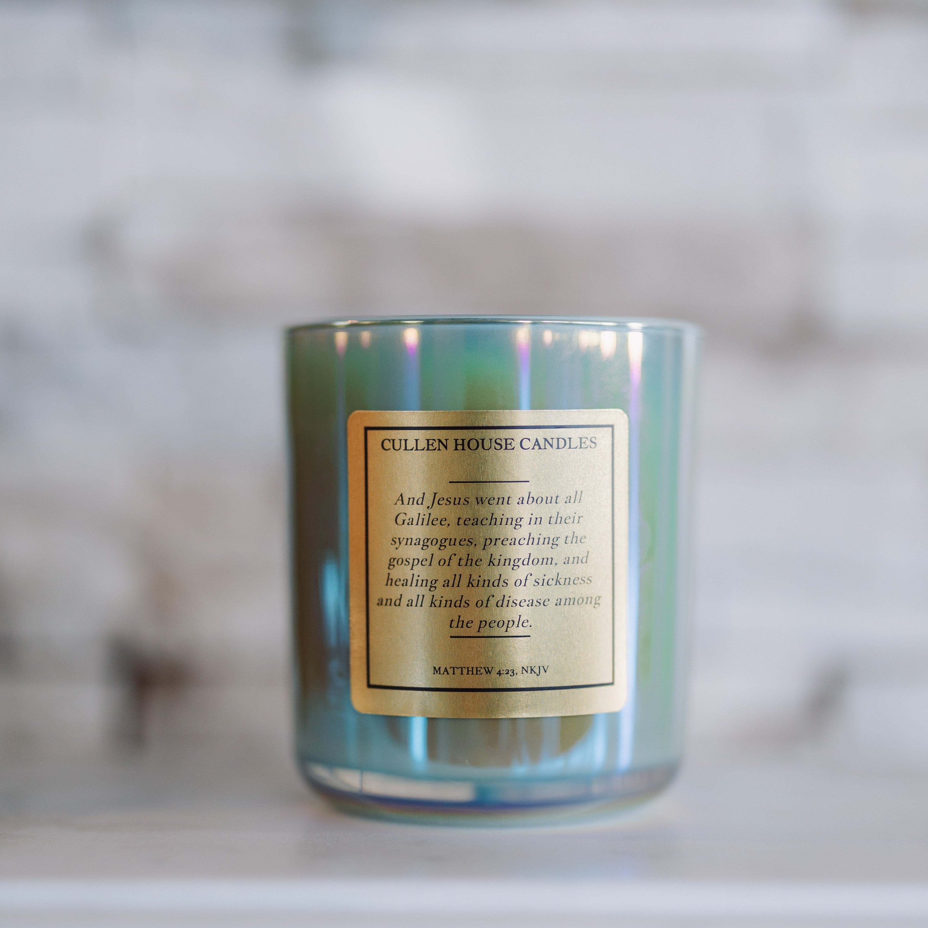 Candle with a label on a marble surface