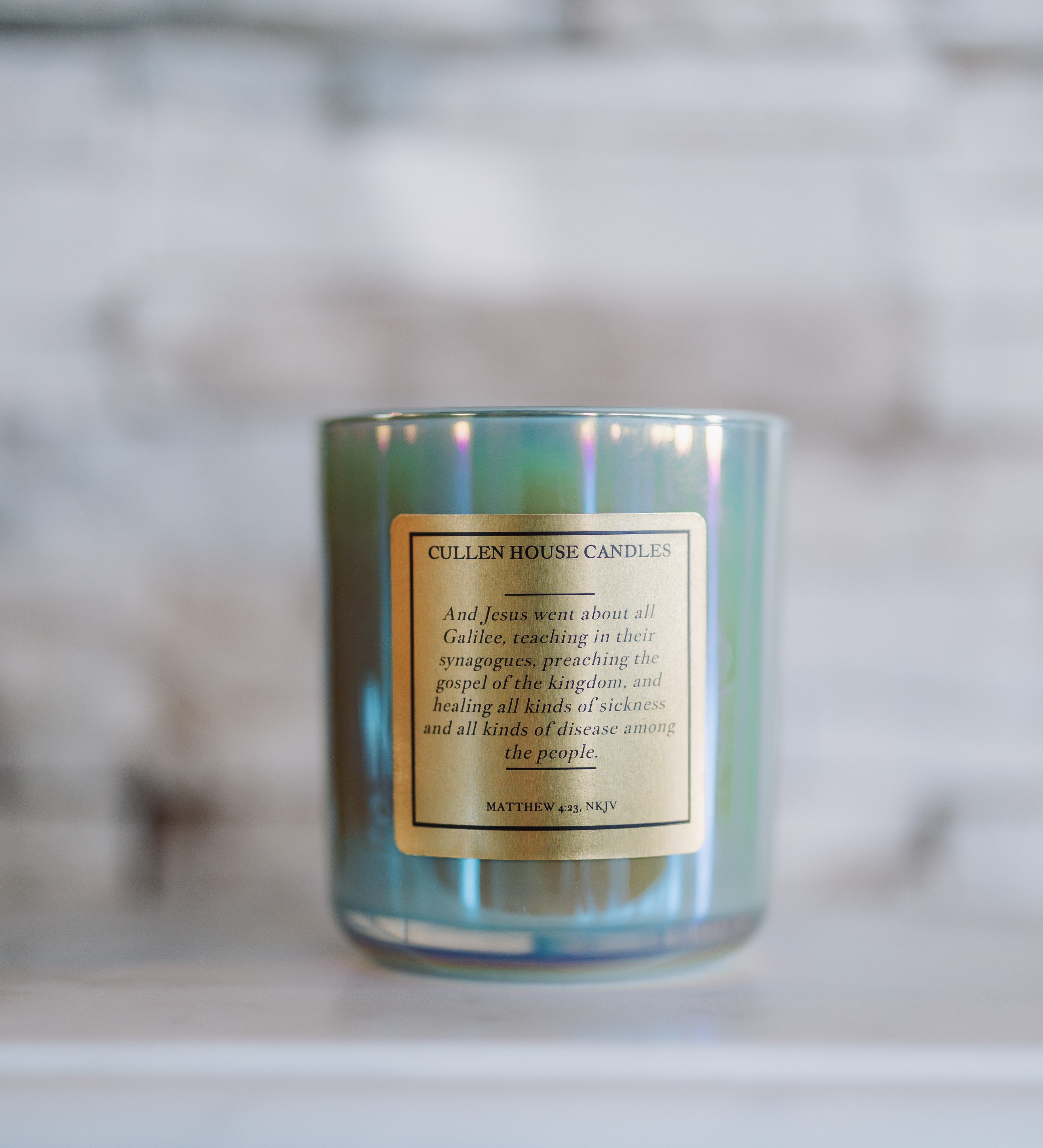 Candle with a label on a marble surface