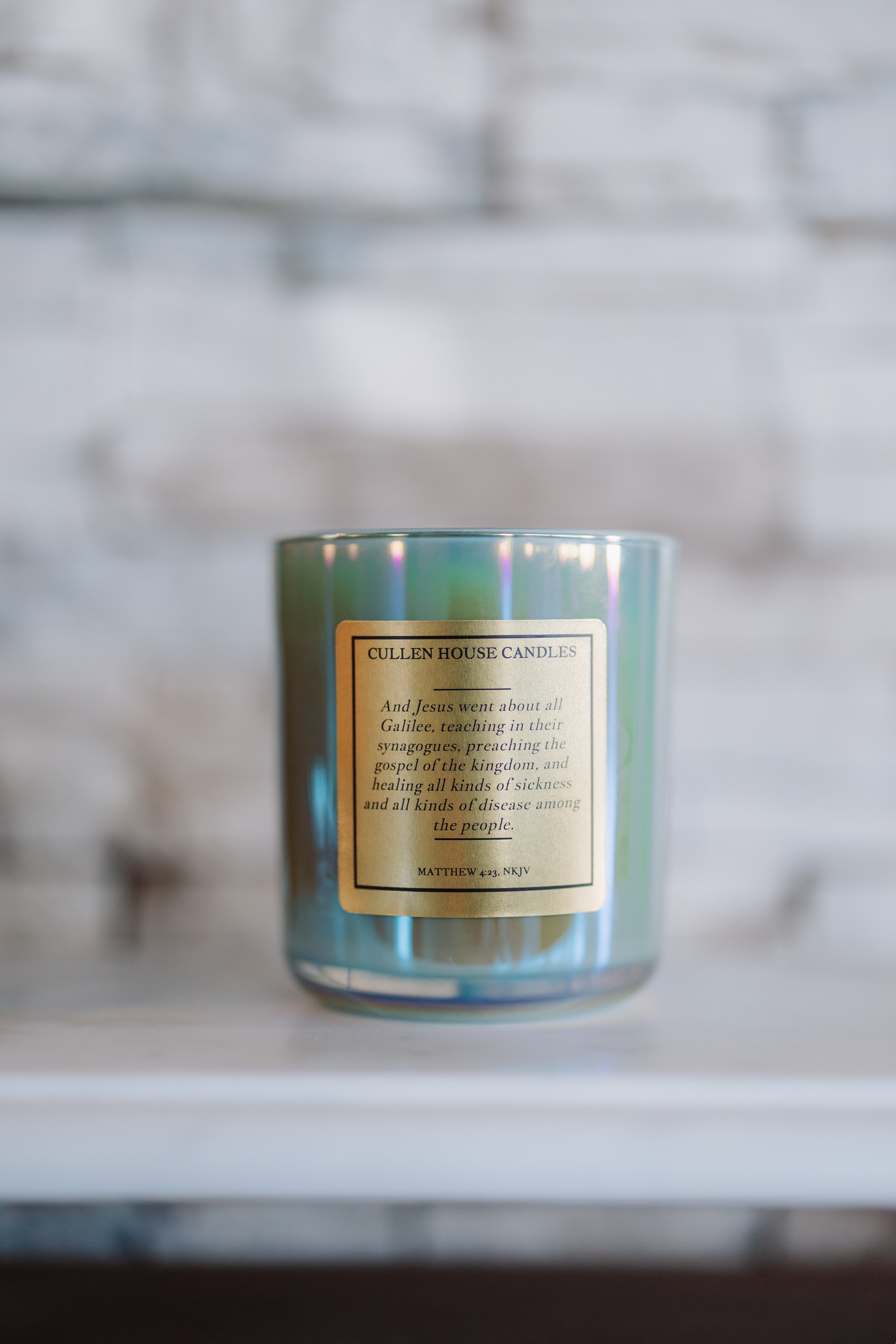 Candle with a label on a marble surface