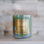 Candle labeled 'Galilee' by Cullen House Candles on a marble surface with a blurred background.