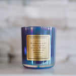 Candle with a label on a marble surface