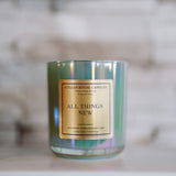 Candle with a gold label on a blurred background