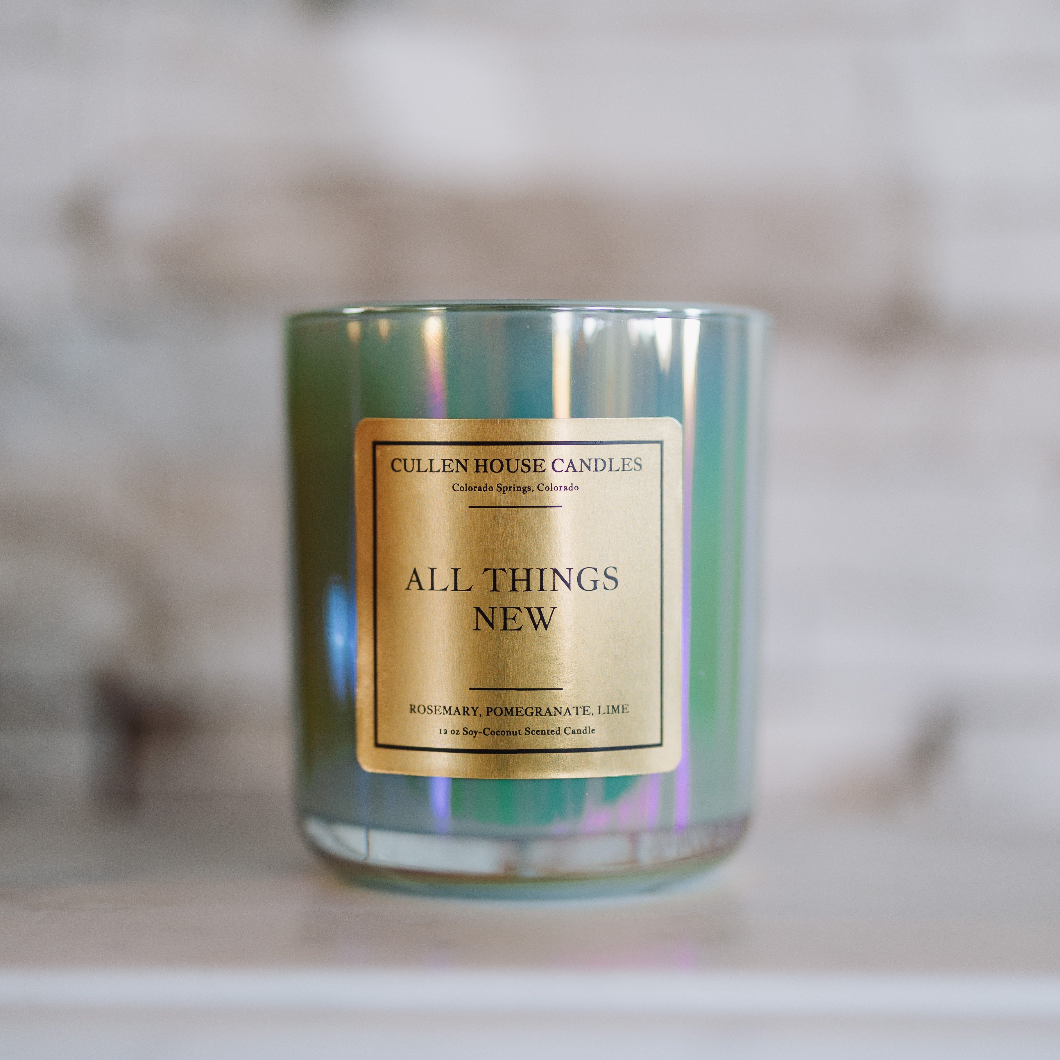 Candle with a gold label on a blurred background