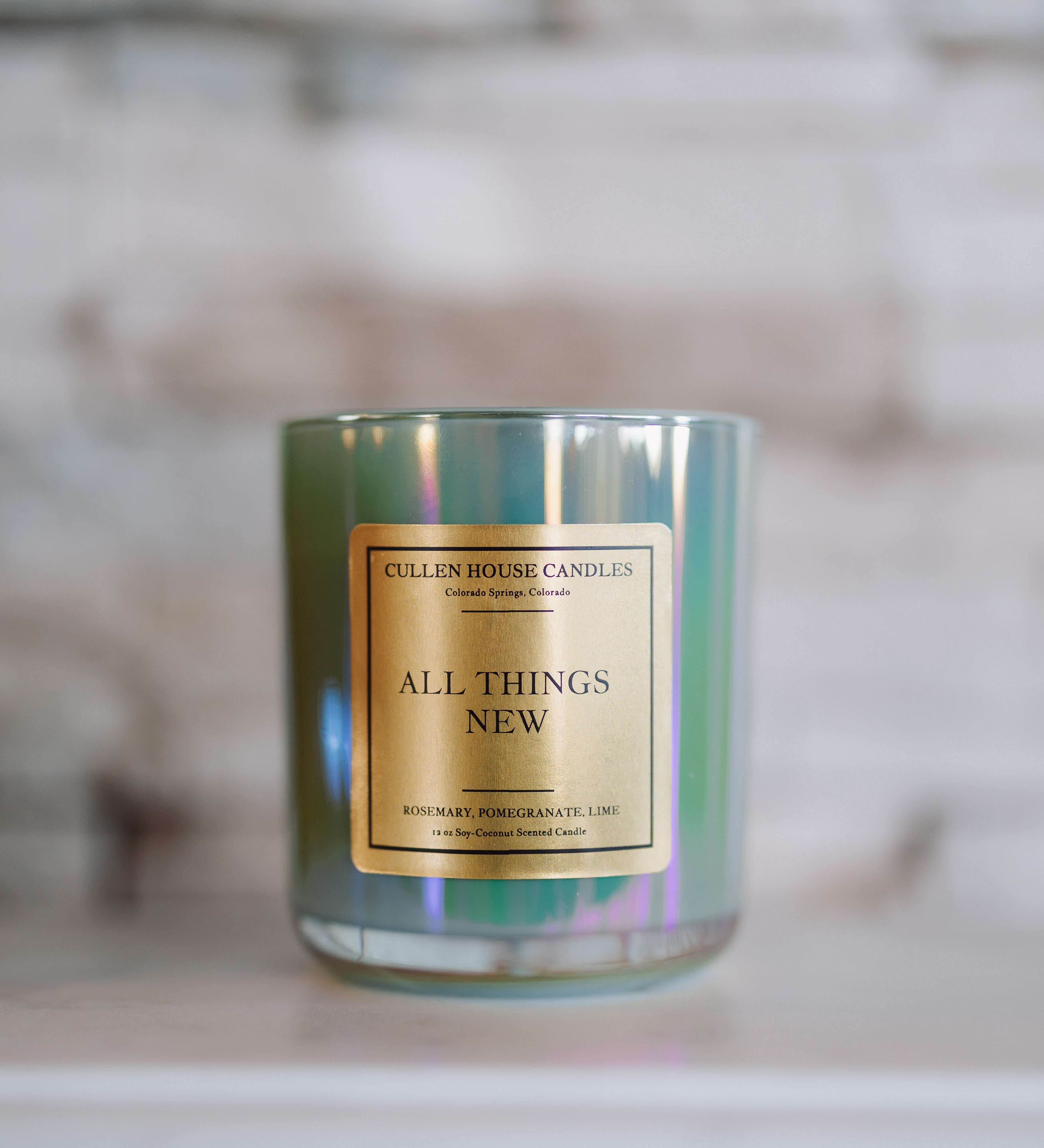 Candle with a gold label on a blurred background