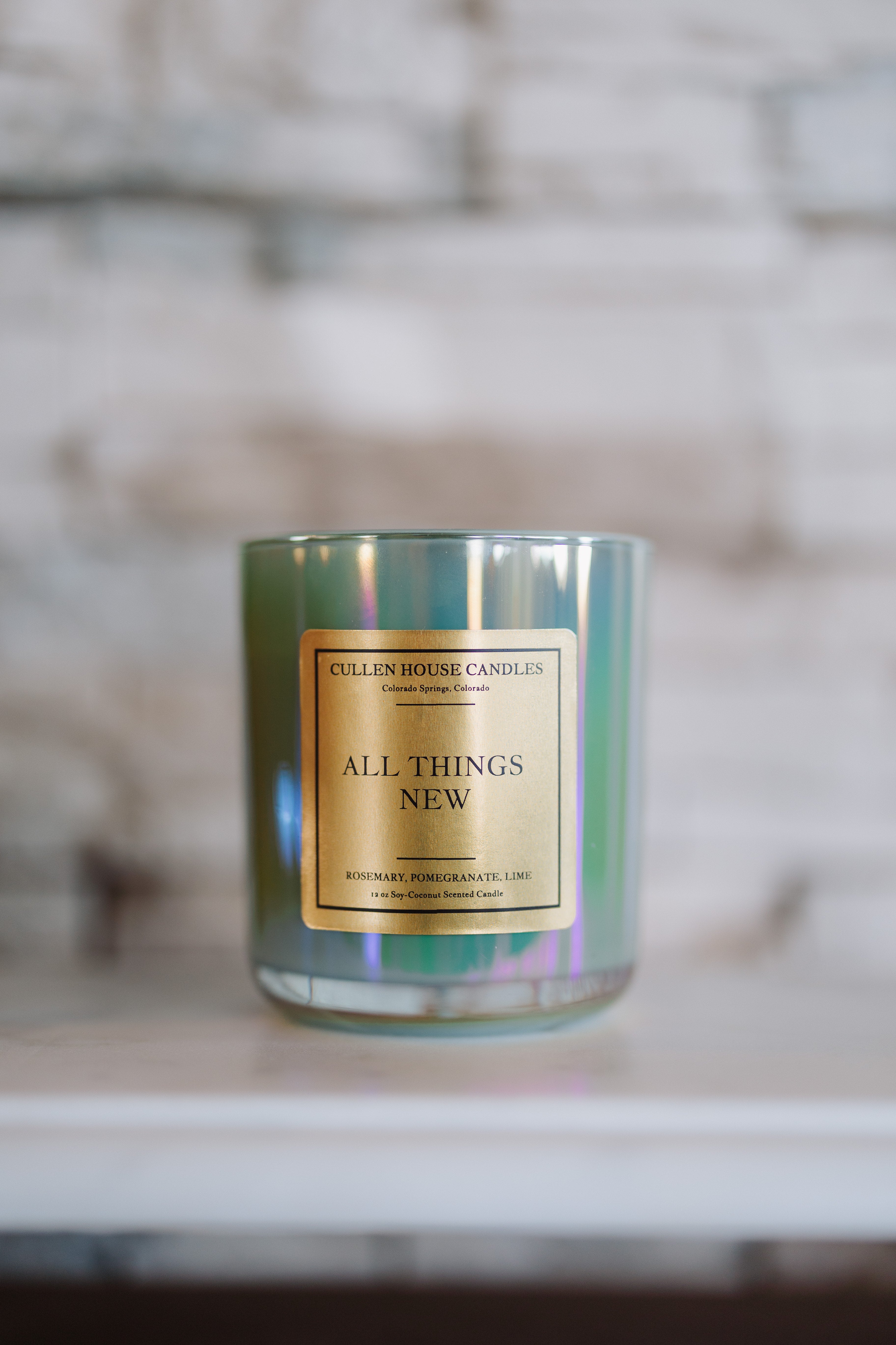 Candle with a gold label on a blurred background