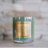 Candle with a gold label on a blurred background